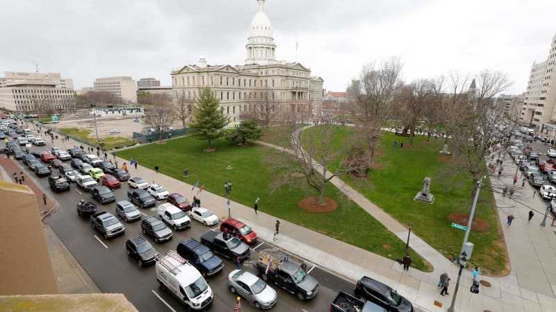 Thousands in cars and out protest Michigan governor's coronavirus social distance order